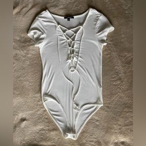 White short sleeve bodysuit size small.